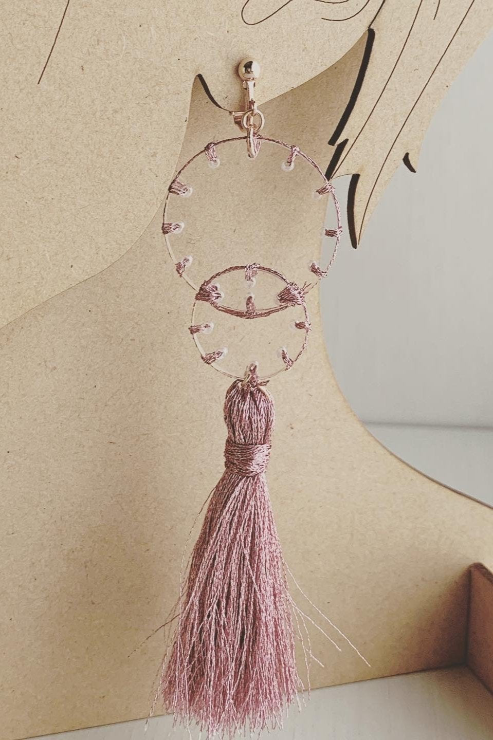 pink stitch layered tassel earrings