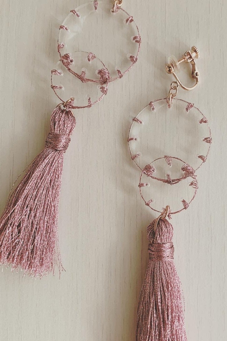 pink stitch layered tassel earrings