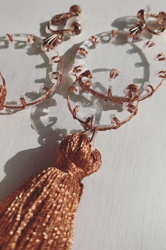 Orange stitch layered tassel earrings