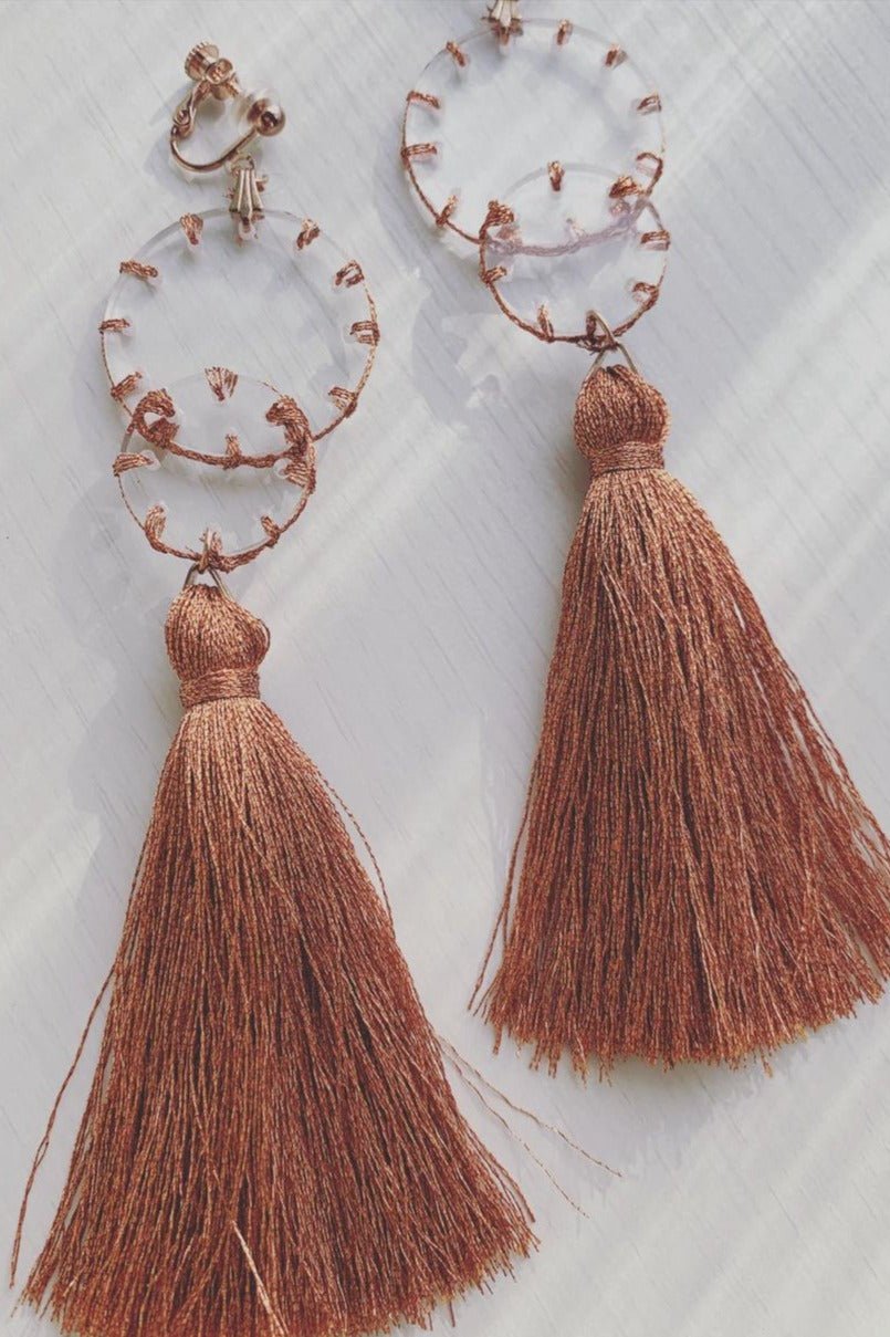 Orange stitch layered tassel earrings