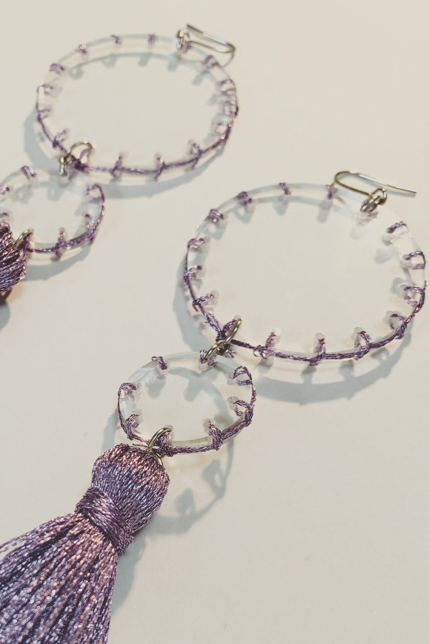 purple stitch tassel earrings