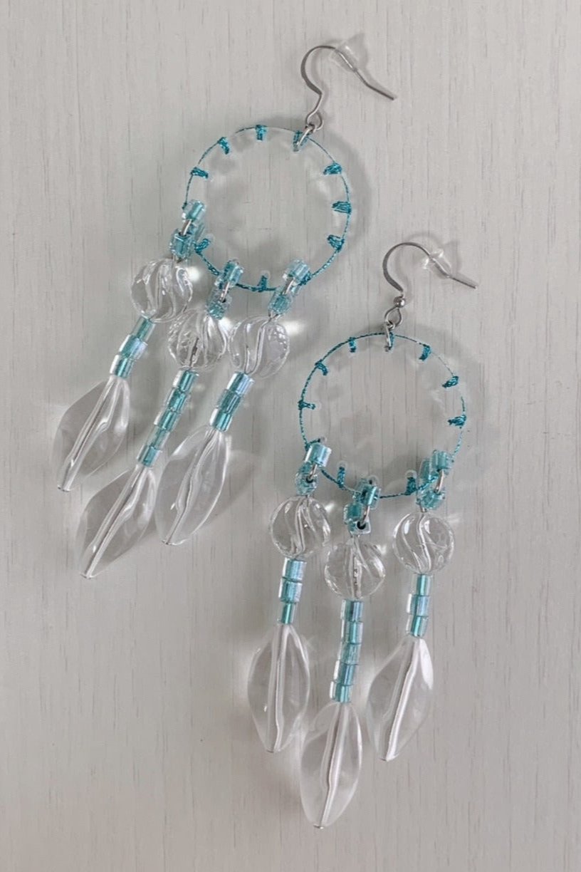 orange stitch tassel earrings