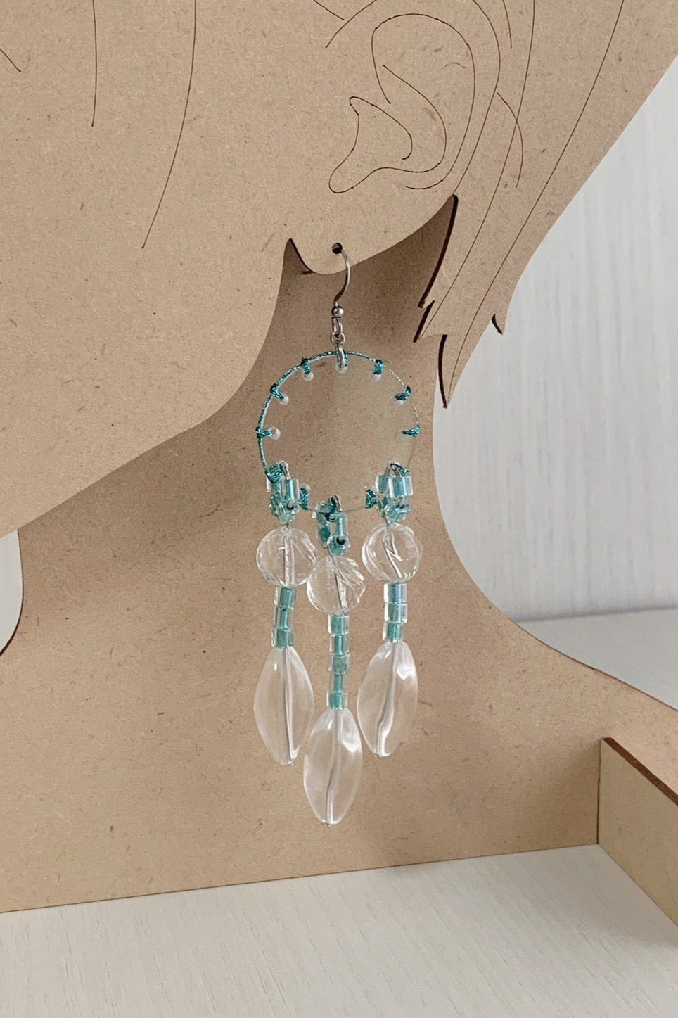 orange stitch tassel earrings