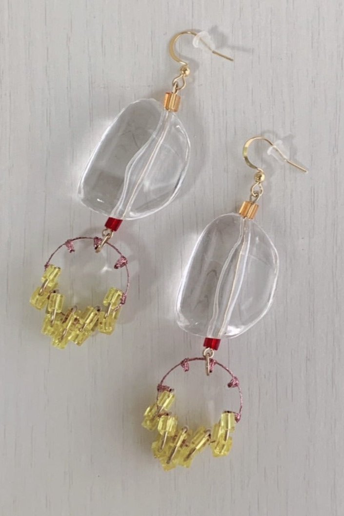 orange stitch tassel earrings