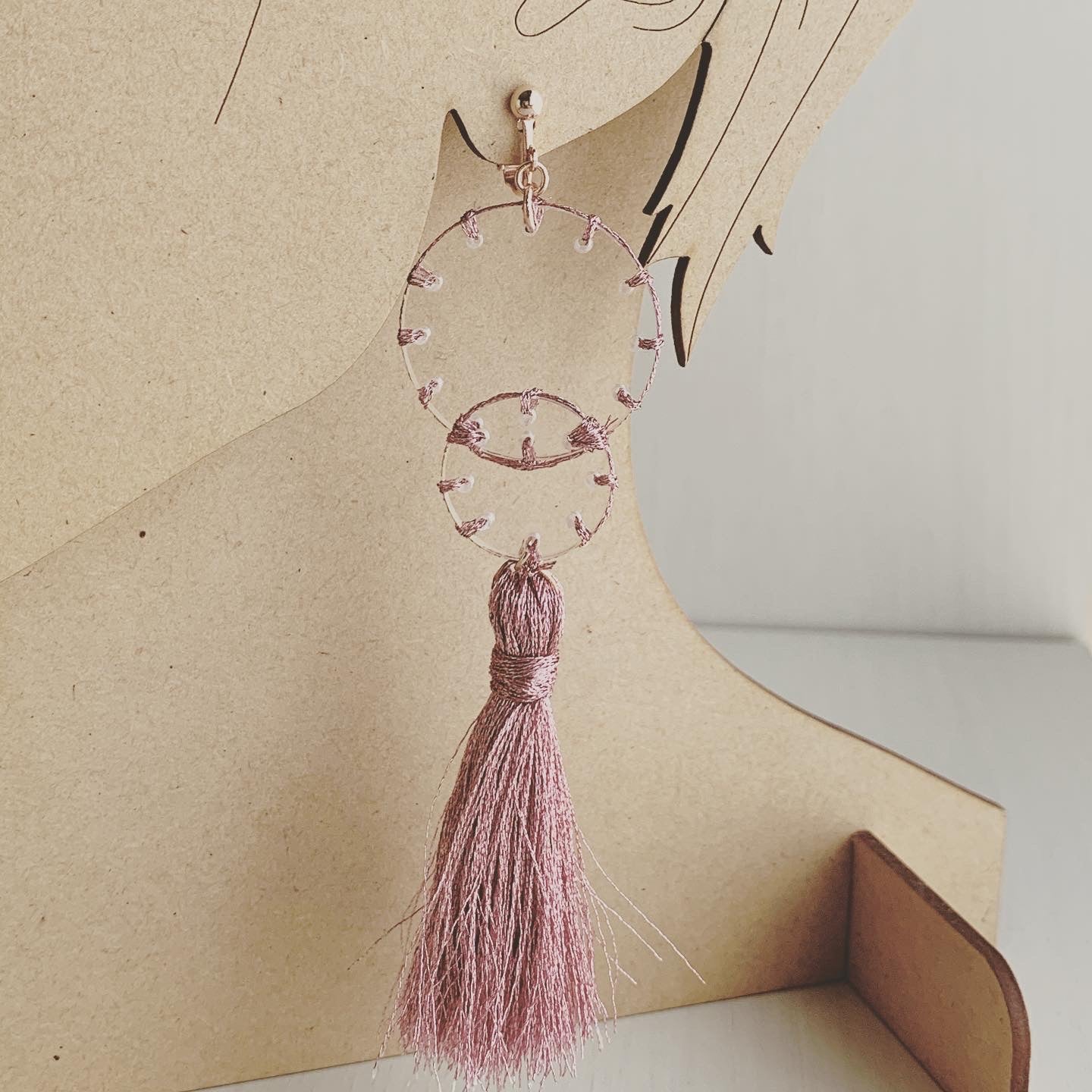 pink stitch layered tassel earrings