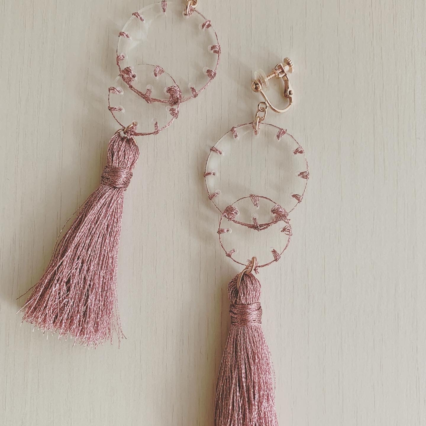 pink stitch layered tassel earrings