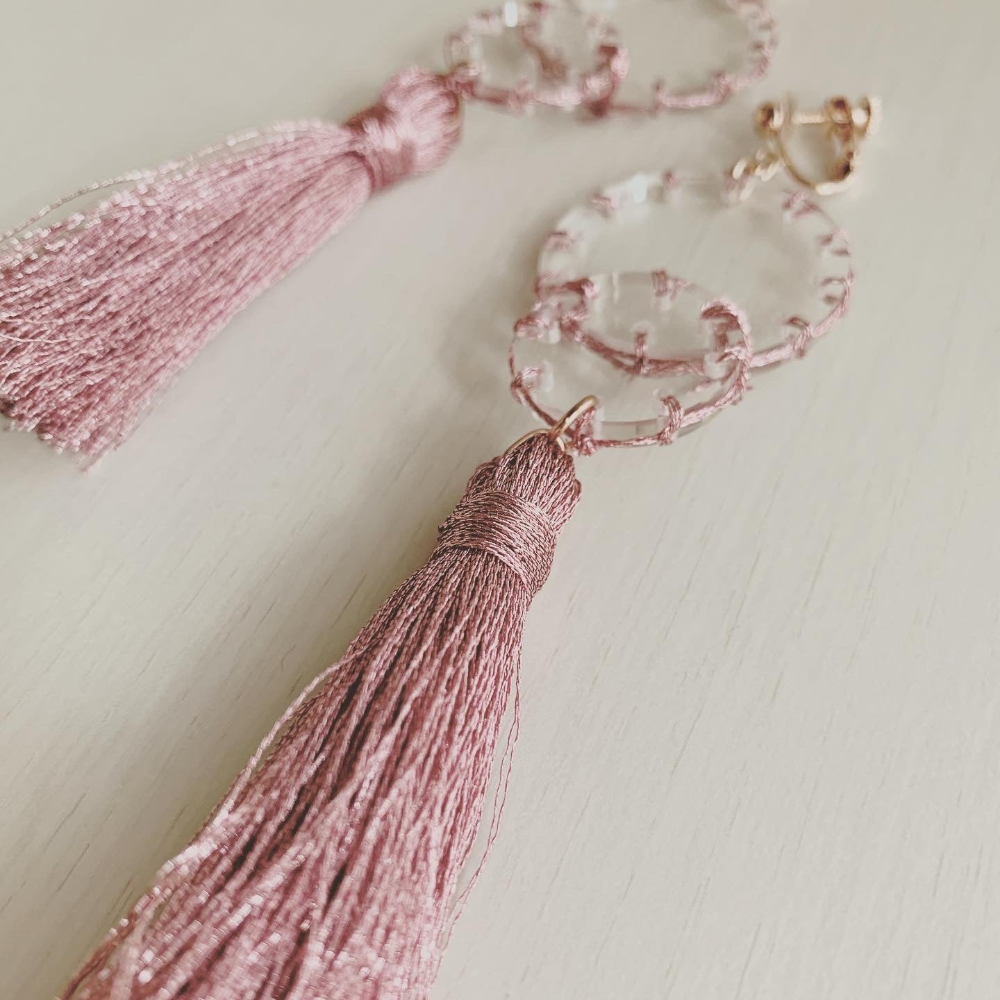 pink stitch layered tassel earrings