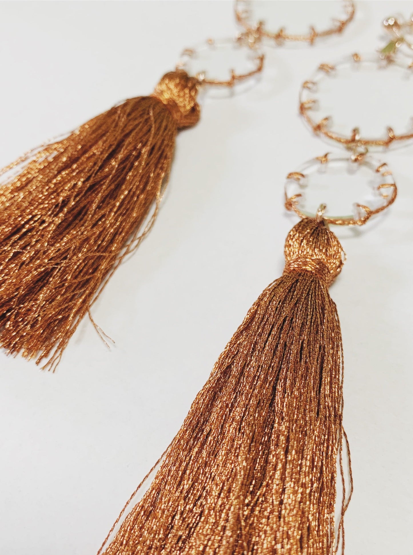 orange stitch tassel earrings