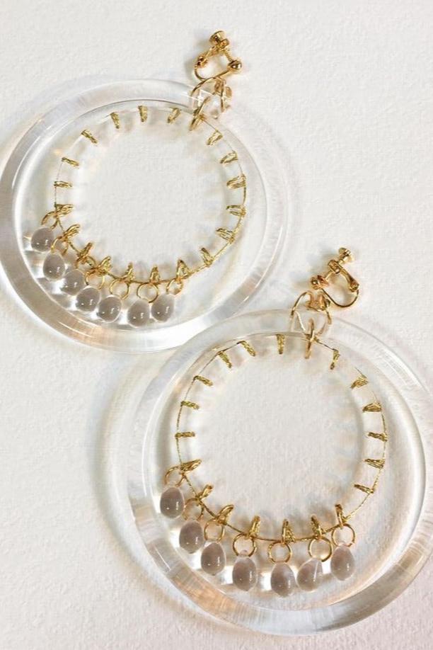 gold stitch clear hoop earrings