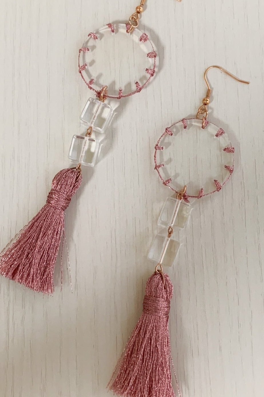 Orange stitch layered tassel earrings