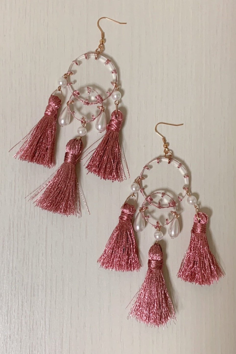 Orange stitch layered tassel earrings